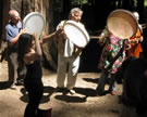 Campers pause to perform in place during the traditional processional down the hill from the Dining Hall to the Dance Hall on the final day of the Mendocino Middle Eastern Music and Dance Camp, California, 2008. Image © Anthony Guest-Scott.