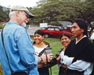 John McDowell interviews the Picuasi Dancers at Yahuar Cocha near Otavalo, Ecuador, 2005. Image © Patricia Glushko.